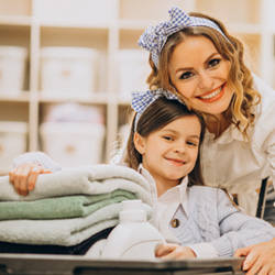 Coventry family enjoying fresh, folded laundry collected and delivered by Easy Laundry