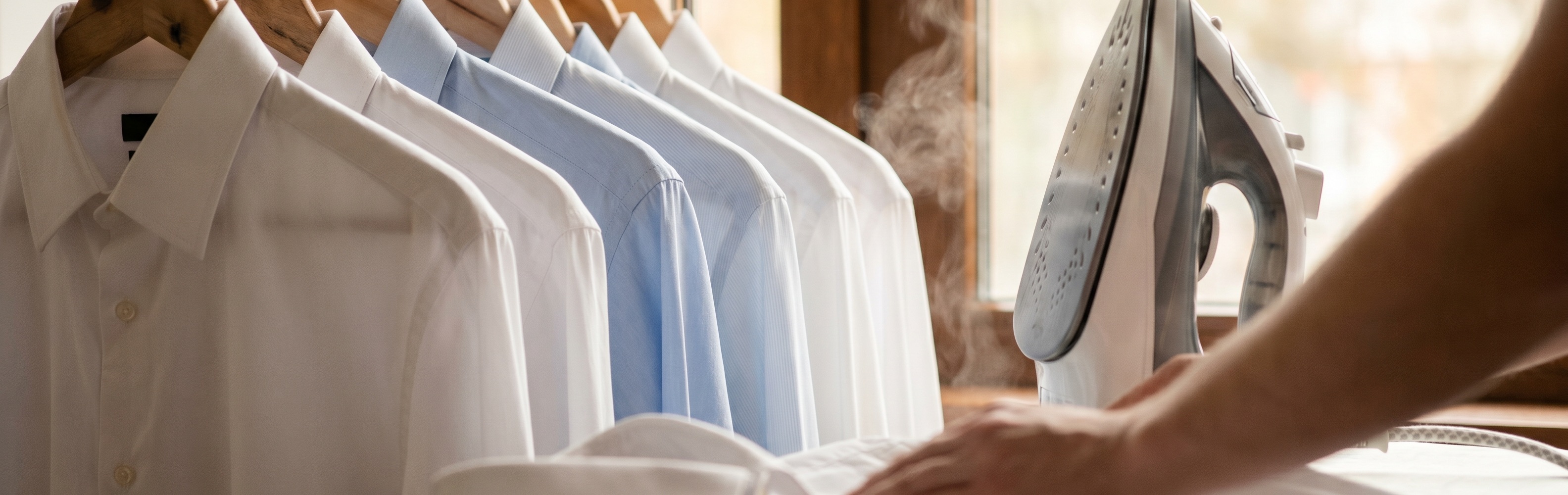 Crisply ironed shirts from our professional ironing service